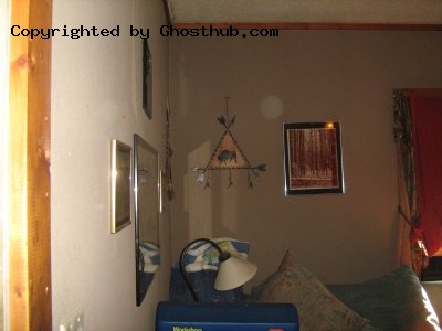 Orb and Praying Figure in corner of room