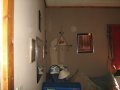 Orb and Praying Figure in corner of room